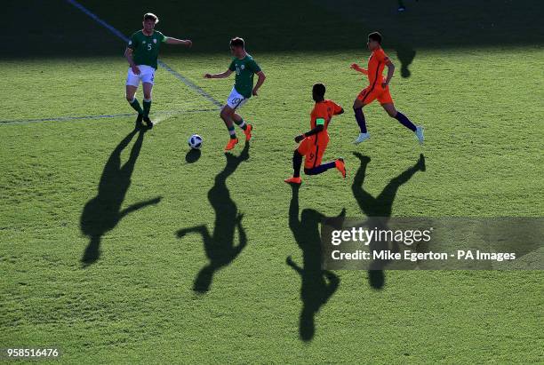 Ireland's Troy Parrott takes on Netherland's Daishawn Redan during the UEFA European U17 Championship quarter final match at the Proact Stadium,...