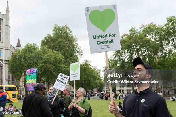 The Grenfell community of survivors, bereaved families and supporters gather in Parliament Square in central London in a peaceful protest as Members...