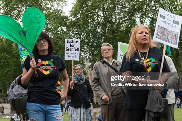 The Grenfell community of survivors, bereaved families and supporters gather in Parliament Square in central London in a peaceful protest as Members...