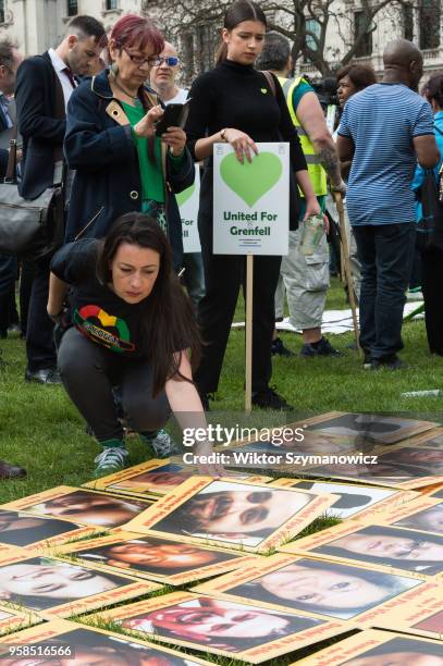 The Grenfell community of survivors, bereaved families and supporters gather in Parliament Square in central London in a peaceful protest as Members...