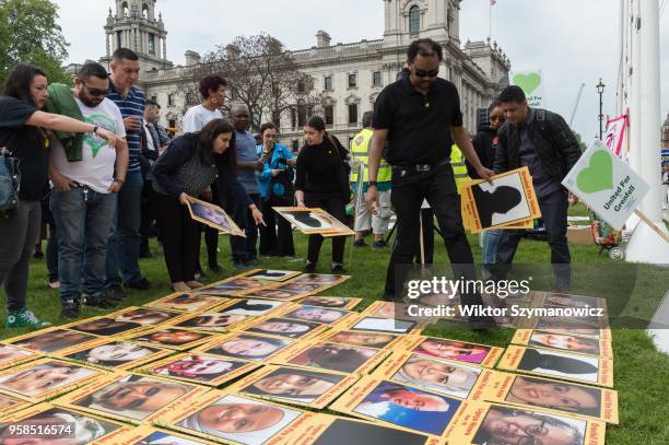 The Grenfell community of survivors, bereaved families and supporters gather in Parliament Square in central London in a peaceful protest as Members...