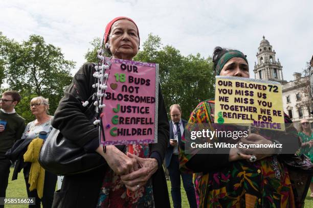 The Grenfell community of survivors, bereaved families and supporters gather in Parliament Square in central London in a peaceful protest as Members...