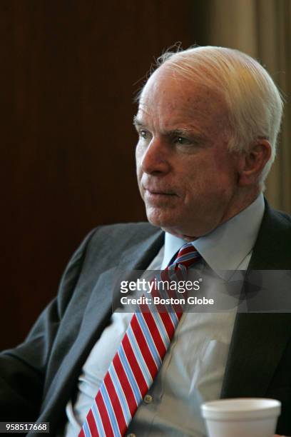 Senator John McCain, Republican presidential candidate, is interviewed by Boston Globe reporters in Boston, MA on June 18, 2007.
