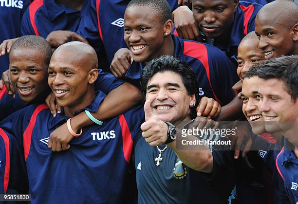 In this handout image provided by the 2010 FIFA World Cup Organising Committee South Africa, Argentina head coach Diego Maradona attends a football...