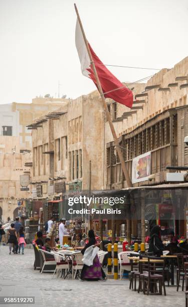 qatar, doha, people resting in souq waqif , old town - doha street stock pictures, royalty-free photos & images