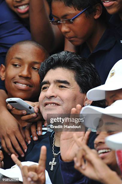 In this handout image provided by the 2010 FIFA World Cup Organising Committee South Africa, Argentina head coach Diego Maradona attends a football...