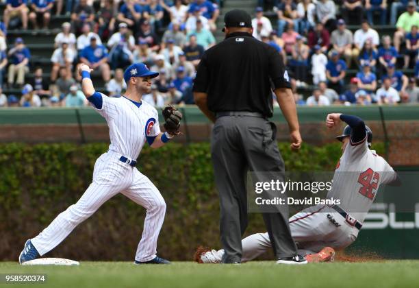 Tommy La Stella of the Chicago Cubs forces out Freddie Freeman of the Atlanta Braves during the first inning while wearing the to commemorate Jackie...