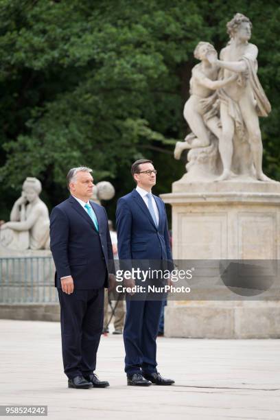Polish Prime Minister Mateusz Morawiecki welcomes Hungarian Prime Minister Viktor Orban in front of the Lazienki Palace in Warsaw, Poland on 14 May...