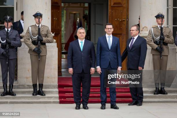 Polish Prime Minister Mateusz Morawiecki welcomes Hungarian Prime Minister Viktor Orban in front of the Lazienki Palace in Warsaw, Poland on 14 May...