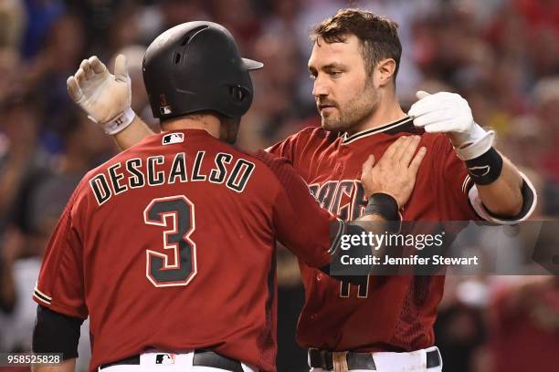 Pollock of the Arizona Diamondbacks is congratulated by Daniel Descalso after scoring in the sixth inning of the MLB game against the Houston Astros...