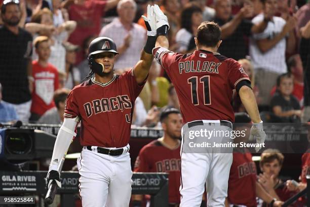 Pollock of the Arizona Diamondbacks is congratulated by Ketel Marte after scoring in the sixth inning of the MLB game against the Houston Astros at...