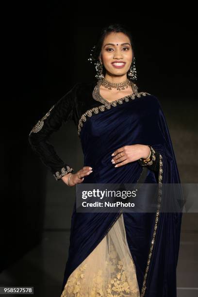 Indian woman wearing an elegant saree during a South Indian fashion show held in Scarborough, Ontario, Canada.