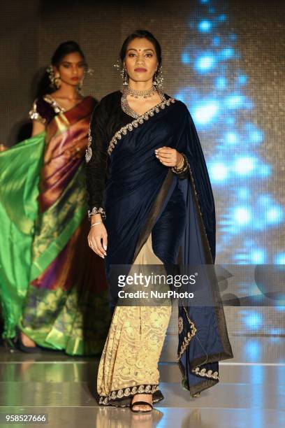 Indian woman wearing an elegant saree during a South Indian fashion show held in Scarborough, Ontario, Canada.