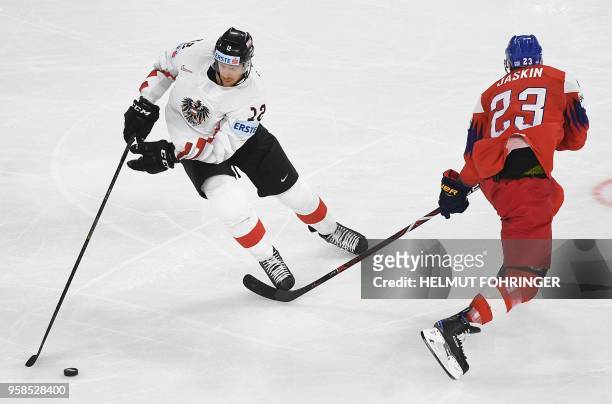 Austria's Michael Raffl and Czech Republic's Dmitrij Jaskin vie during the group A match Czech Republic vs Austria of the 2018 IIHF Ice Hockey World...