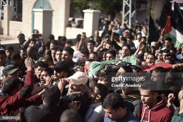 Mourners carry dead body of Fadi Abu Salah, who lost his legs during an Israeli assault on 2008, and has been killed in Israeli security forces'...