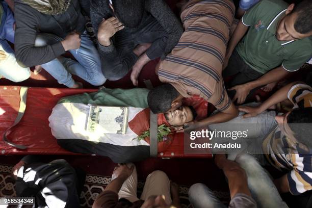 Mourners perform funeral prayer of Fadi Abu Salah, who lost his legs during an Israeli assault on 2008, and has been killed in Israeli security...