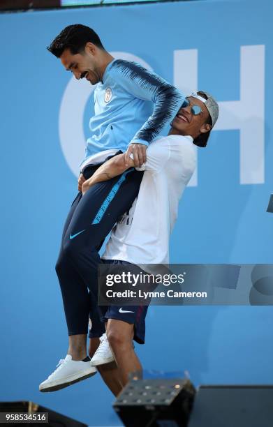 Ilkay Gundogan of Manchester City and Leroy Sane of Manchester City on stage during the Manchester City Trophy Parade in Manchester city centre on...