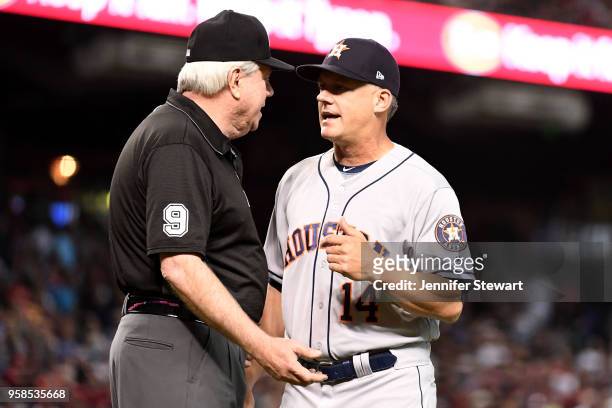 Umpire Brian Gorman talks with AJ Hinch of the Houston Astros about a play in the sixth inning of the MLB game against the Arizona Diamondbacks at...