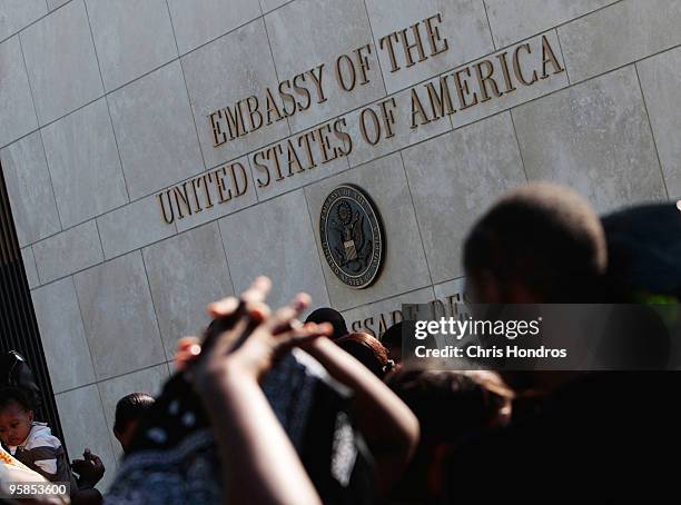 Hundreds of people, some with U.S. Passports, stand in a long line outside of the American embassy as they try to escape Haiti January 18, 2010 in...