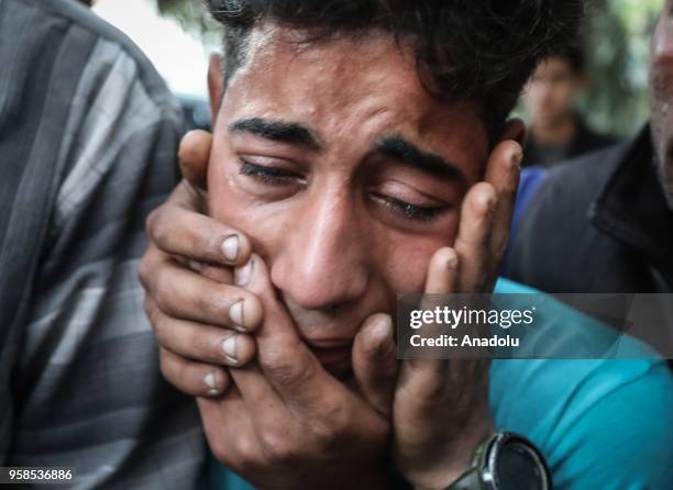 Relatives of Yazen Traboulsi who was killed east of Khan Yunis city by Israeli army fire, mourn at al-Shifa hospital in Gaza City, Gaza on May 14,...