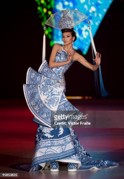 Model showcases designs by Guo Pei of China on the catwalk during the HK Fashion Extravaganza 2010 show as part of the Hong Kong Fashion Week...