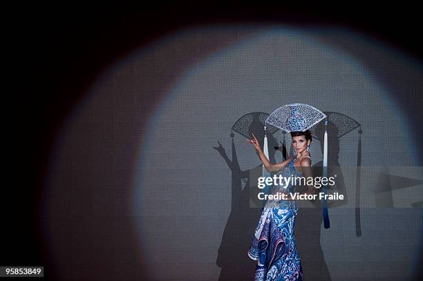 Model showcases designs by Guo Pei of China on the catwalk during the HK Fashion Extravaganza 2010 show as part of the Hong Kong Fashion Week...