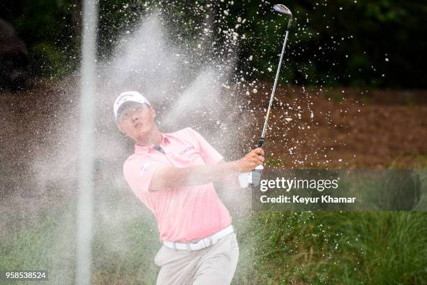 Danny Lee of New Zealand hits out of a bunker on the 14th hole during the final round of THE PLAYERS Championship on THE PLAYERS Stadium Course at...