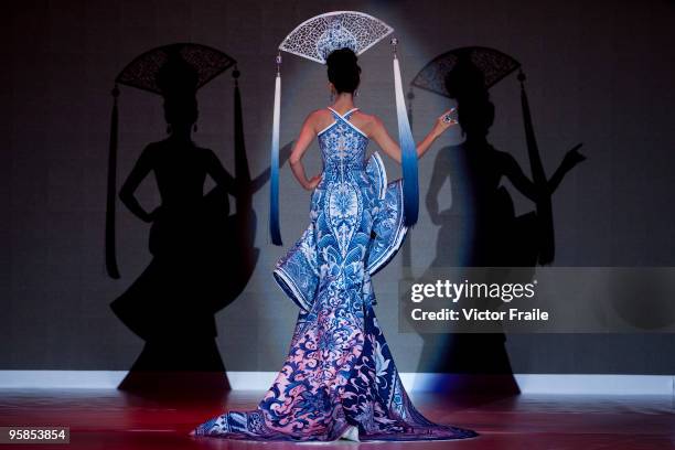 Model showcases designs by Guo Pei of China on the catwalk during the HK Fashion Extravaganza 2010 show as part of the Hong Kong Fashion Week...