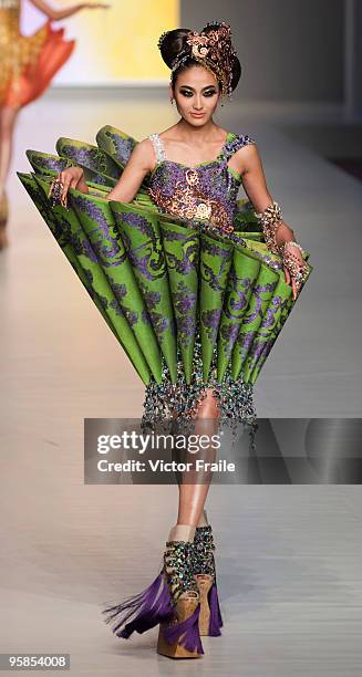 Model showcases designs by Guo Pei of China on the catwalk during the HK Fashion Extravaganza 2010 show as part of the Hong Kong Fashion Week...