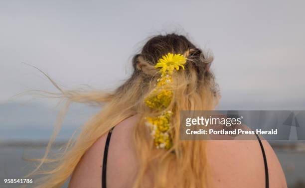 Molly Carbonneau, a senior Casco Bay, styled her hair with fresh flowers for prom night.
