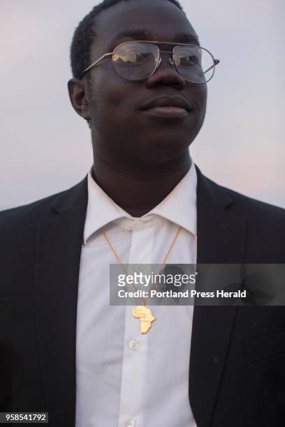 Casco Bay senior Ochan Ogak poses for a portrait on the Eastern Promenade before heading to his final prom of high school. Ogak just received the...