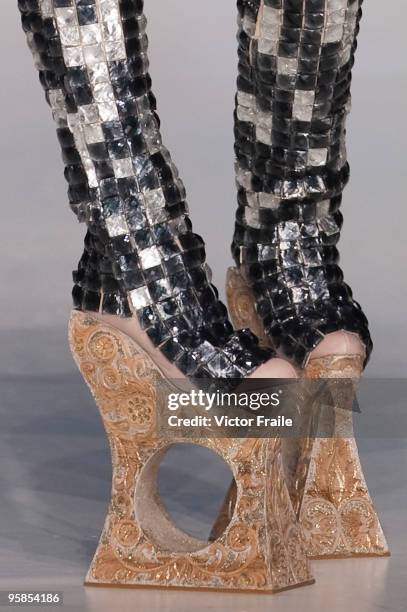 Model showcases designs by Guo Pei of China on the catwalk during the HK Fashion Extravaganza 2010 show as part of the Hong Kong Fashion Week...