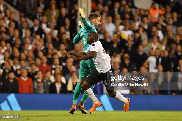 Aboubakar Kamara of Fulham clashes with Scott Carson of Derby County during the Sky Bet Championship Play Off Semi Final, second leg match between...