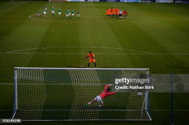 Daishawn Redan of Netherlands scores the winning penalty during the UEFA European Under-17 Championship match between Netherlands and Ireland at...