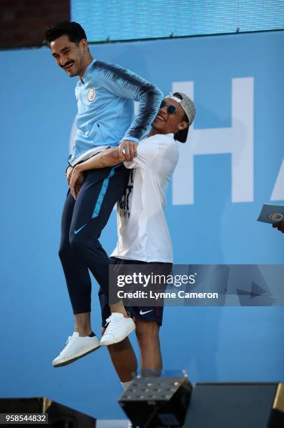 Ilkay Gundogan of Manchester City and Leroy Sane of Manchester City on stage during the Manchester City Trophy Parade in Manchester city centre on...