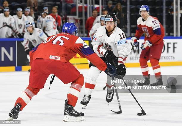 Austria's Michael Raffl and Czech Republic's Jakub Krejcik vie during the group A match Czech Republic vs Austria of the 2018 IIHF Ice Hockey World...