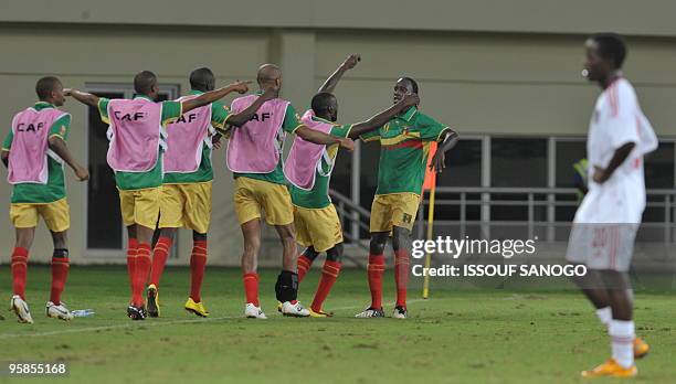 Aigles du Mali, National football team of Mali players celebrate a goal against Malawi on January 18, 2010 at the Chiazi stadium in Cabinda during...