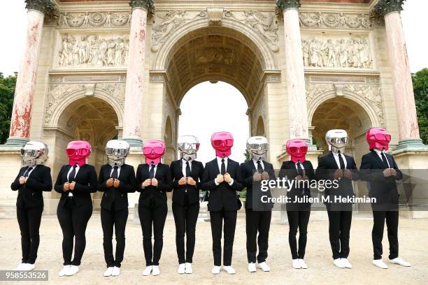 Beauty Butlers Flashmob performs in front of Paris monuments as part of KARL LAGERFELD & ModelCo. Product launch on May 14, 2018 in Paris, France.