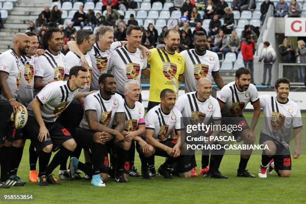 Former French rugby and football internationals pose before taking part in the charity match organized by French football player Pascal Olmeta for...