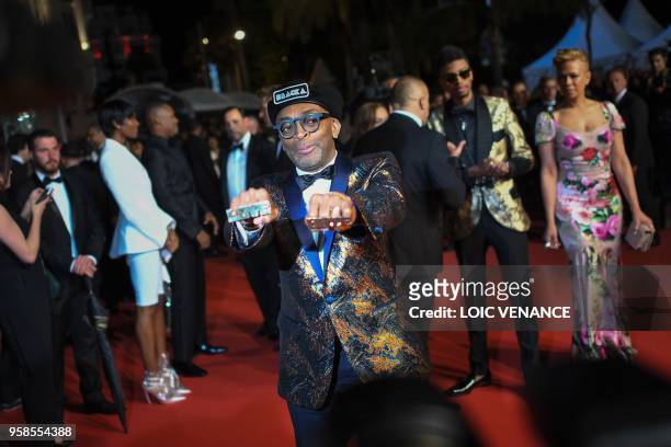 Director Spike Lee poses as he leaves along with his wife Tonya Lewis Lee and their son Jackson Lee on May 14, 2018 following the screening of the...