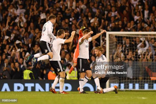 Oliver Norwood of Fulham and Ryan Sessegnon of Fulham celebrates with team mates at the final whistle during the Sky Bet Championship Play Off Semi...