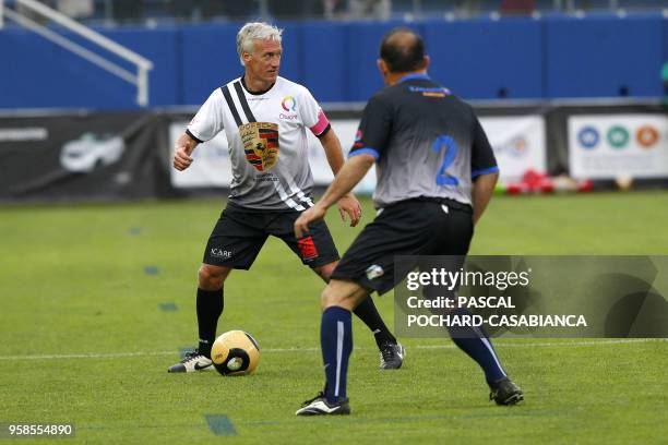 France's coach Didier Deschamps takes part in the charity match organized by French football player Pascal Olmeta for his association "Un Sourire Un...