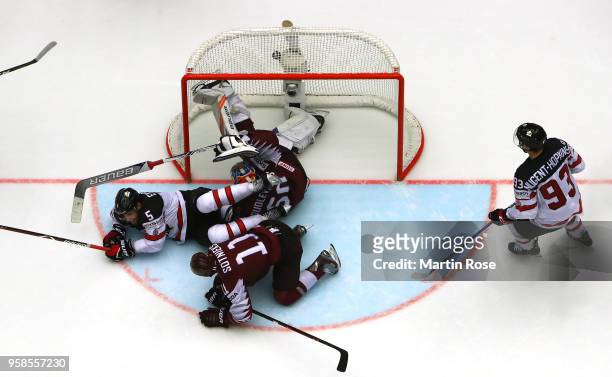 Team Canada scores the game winning goal over of Latvia during extra time during the 2018 IIHF Ice Hockey World Championship Group B game between...