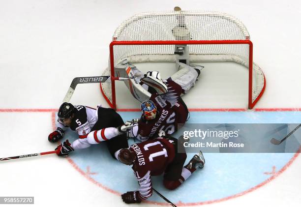 Team Canada scores the game winning goal over of Latvia during extra time during the 2018 IIHF Ice Hockey World Championship Group B game between...