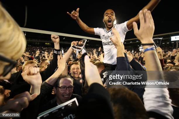 Denis Odoi of Fulham is carried on the shoulder of the fans as they celebrate making the play-off final during the Sky Bet Championship Play Off Semi...