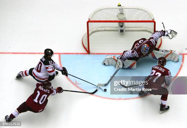 Kristers Gudlevskis, goaltender of Latvia tends net against Bryaden Schenn of Canada during the 2018 IIHF Ice Hockey World Championship Group B game...