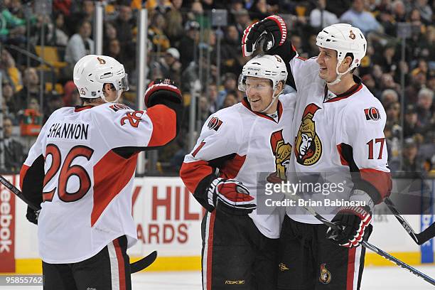 Ryan Shannon, Daniel Alfredsson and Filip Kuba of the Ottawa Senators celebrate a goal against the Boston Bruins at the TD Garden on January 18, 2010...
