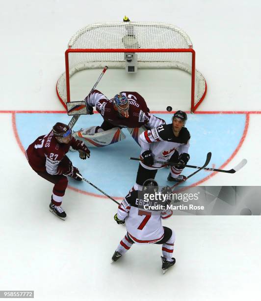 Kristers Gudlevskis, goaltender of Latvia tends net against Tyson Jost of Canada during the 2018 IIHF Ice Hockey World Championship Group B game...
