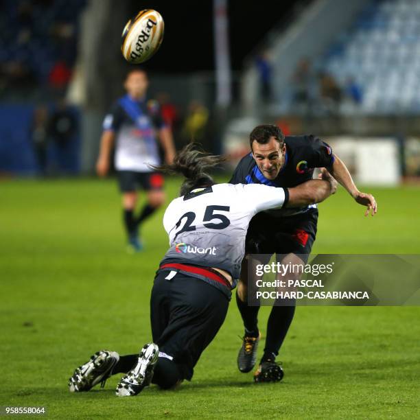 Former French rugby international Sebastien Chabal vies with Former French football international Sebastien Squillaci during the charity match...