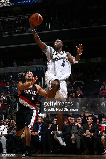 Antawn Jamison of the Washington Wizards shoots against Juwan Howard of the Portland Trail Blazers at the Verizon Center on January 18, 2010 in...